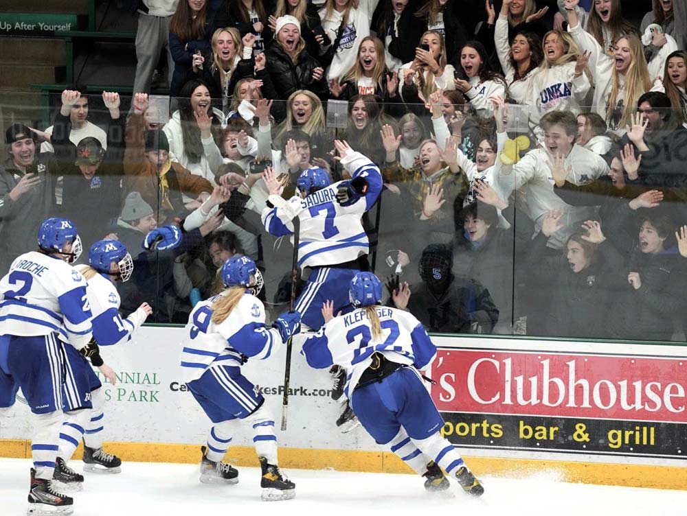 Grace Sadura and her Minnetonka teammates celebrate her game-winning overtime goal against Holy Family in the Section 2AA final.